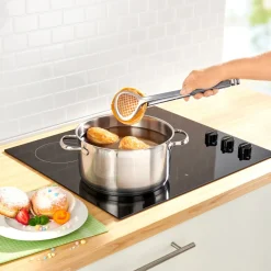 Die moderne Hausfrau Frittier-Zange